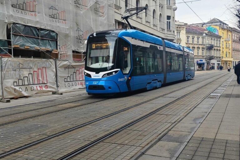 Blue low-floor ZET tram number 12 on Ilica street in Zagreb for stroller-friendly travel