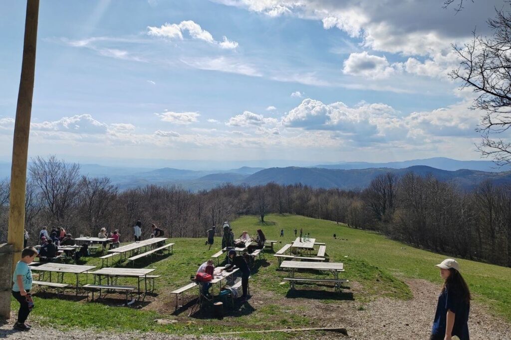 Family picnic area and open green meadow in front of Planinarski dom Zitnica on Japetic near Samobor